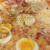 Salsa di pomodoro, Mozzarella, Cipolla, Salamino piccante, uovo, Prosciutto cotto